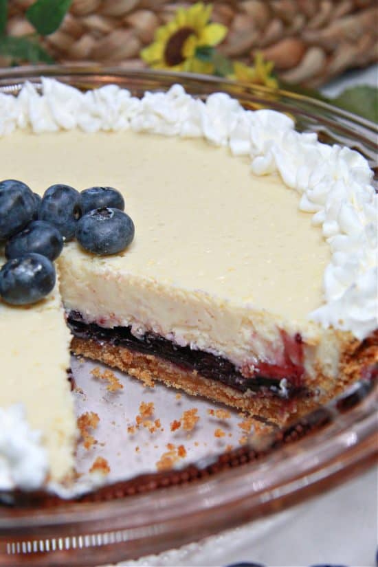 Lemon Blueberry Pie combines a tangy cheesecake layer with sweet blueberries and a buttery crust.
