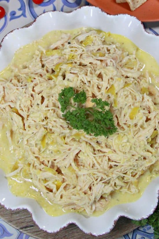 Slow Cooker Zesty Chicken is flexible to serve in tacos or burritos, over rice or mashed potatoes, or as is.
