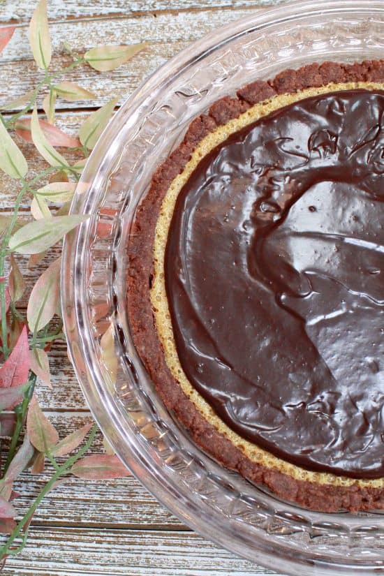 A shortbread cocoa crust holds a peanut butter filling topped with a rich ganache.