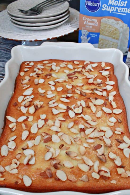 Toasted almonds top this light and tasty dessert made with a boxed cake mix and cheese.
