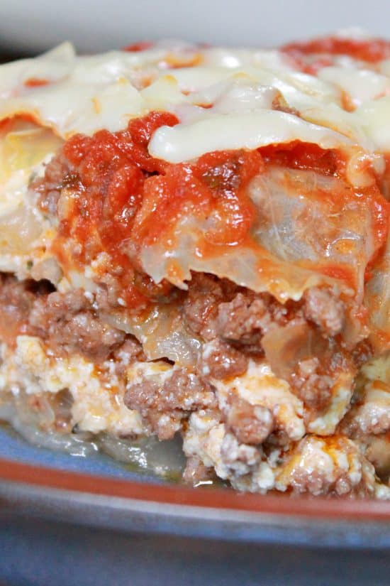 Layers of seasoned meat, ricotta cheese, and cabbage, all topped with marinara sauce and mozzarella cheese.