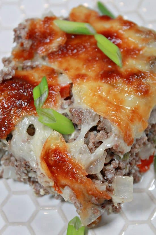 Melty provolone cheese topping  a delicious meal of beef, veggies, and an egg custard holding it together.