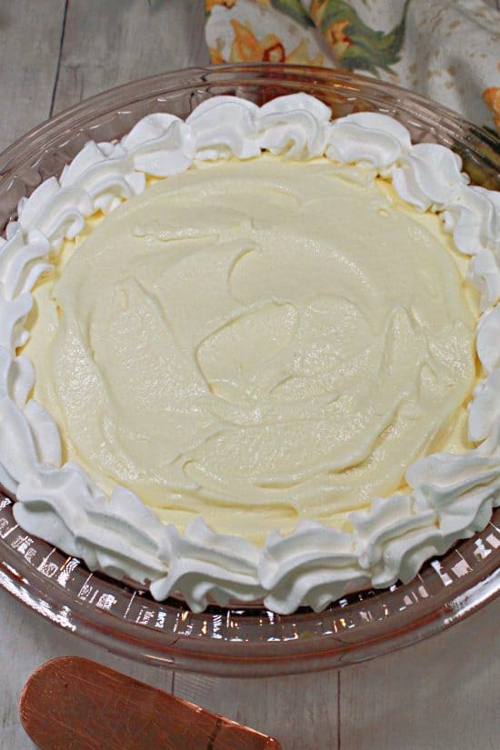 Salted Caramel Banana Pie layers buttery caramel pecans, fresh bananas, and a fluffy pudding-cream filling.