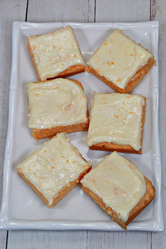 A quick and easy dessert made with a cake mix, fresh orange zest, and a tangy cream cheese frosting.