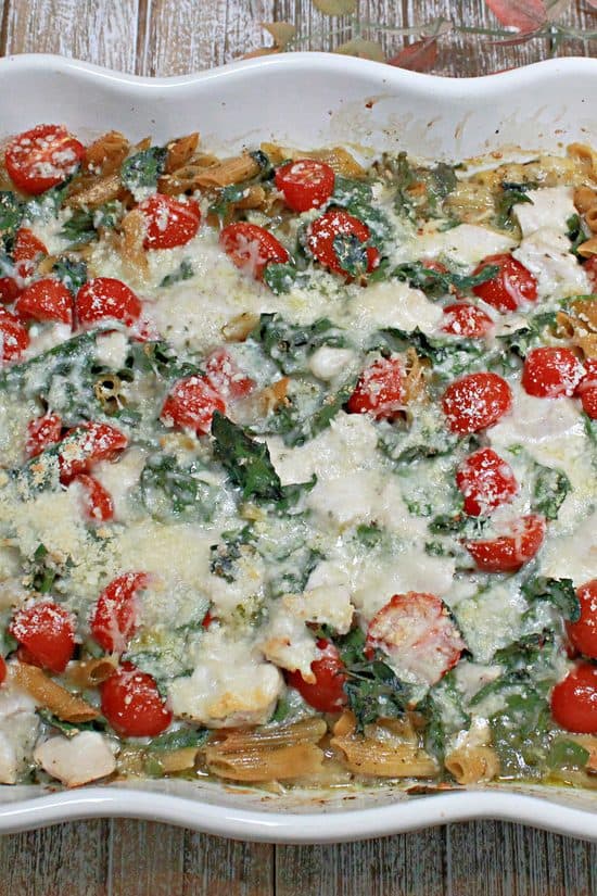 A one-dish, easy dinner made with penne, fresh tomatoes, and seasoned chicken baked in a delicious sauce.